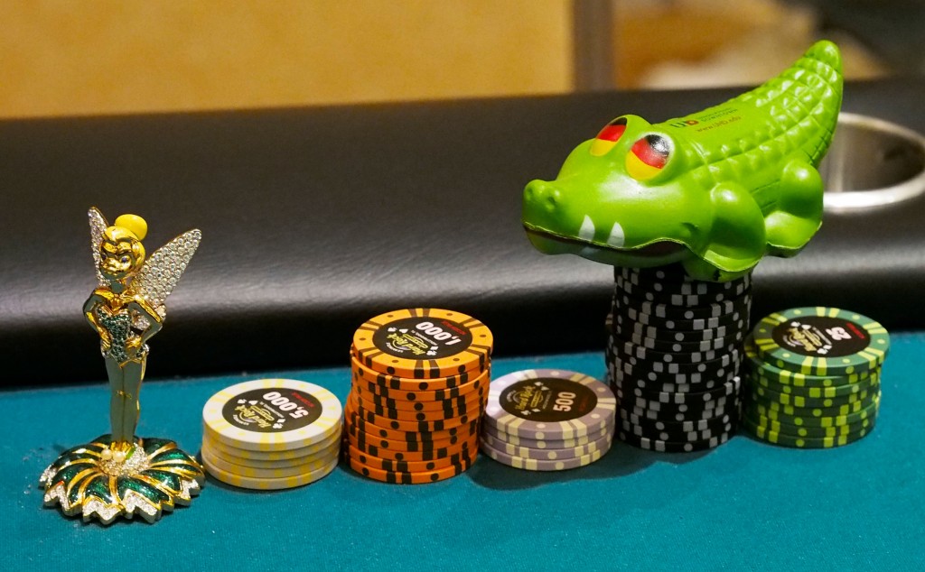 Nariman Daruvalla has an alligator and a Tinkerbell figurine to guard his chips and protect his cards.